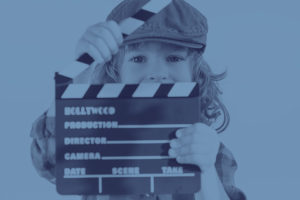 Child holding clapperboard